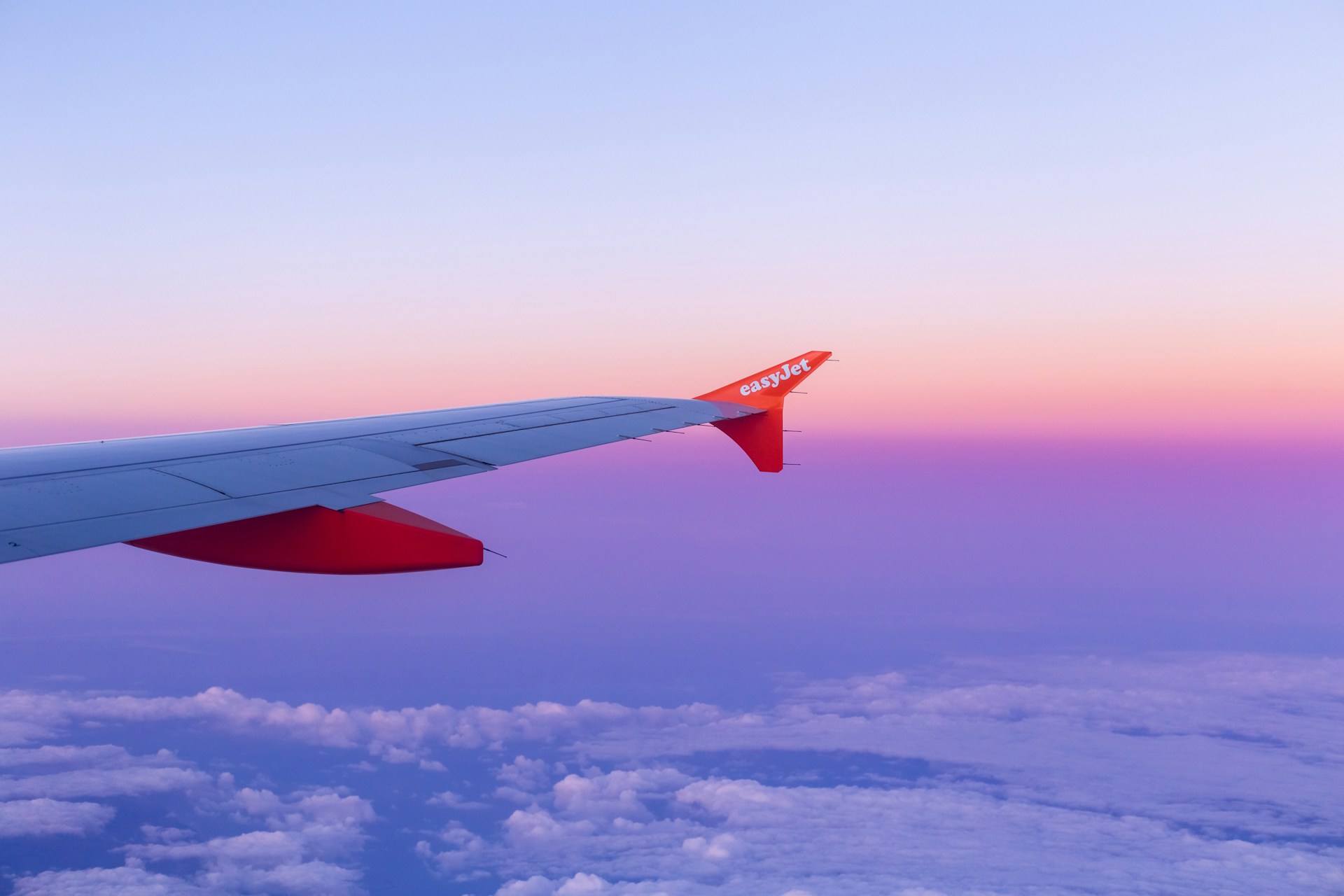 A plane wing with easyJet branding