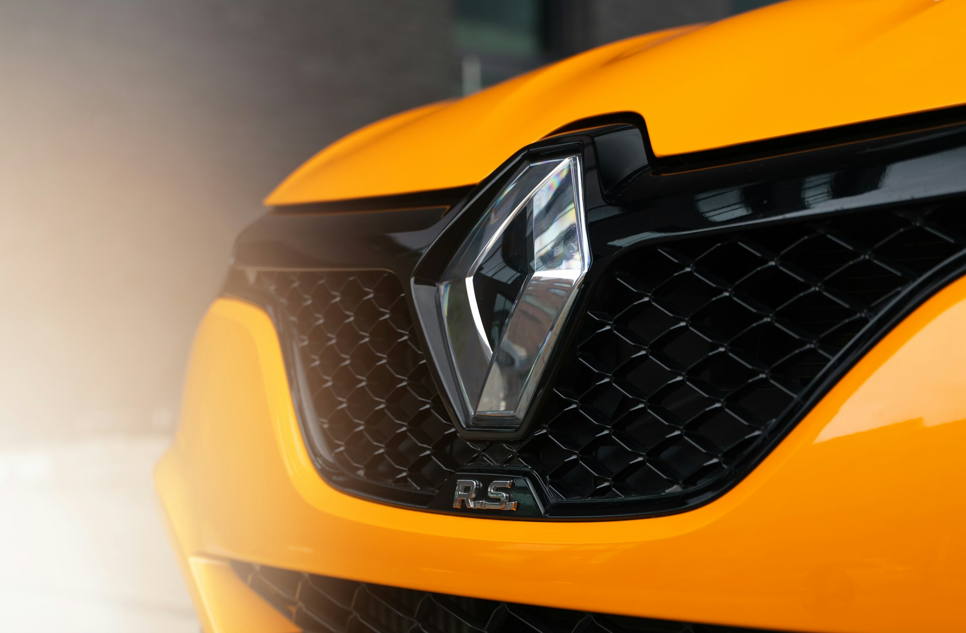 Close up of the logo on an orange Renault